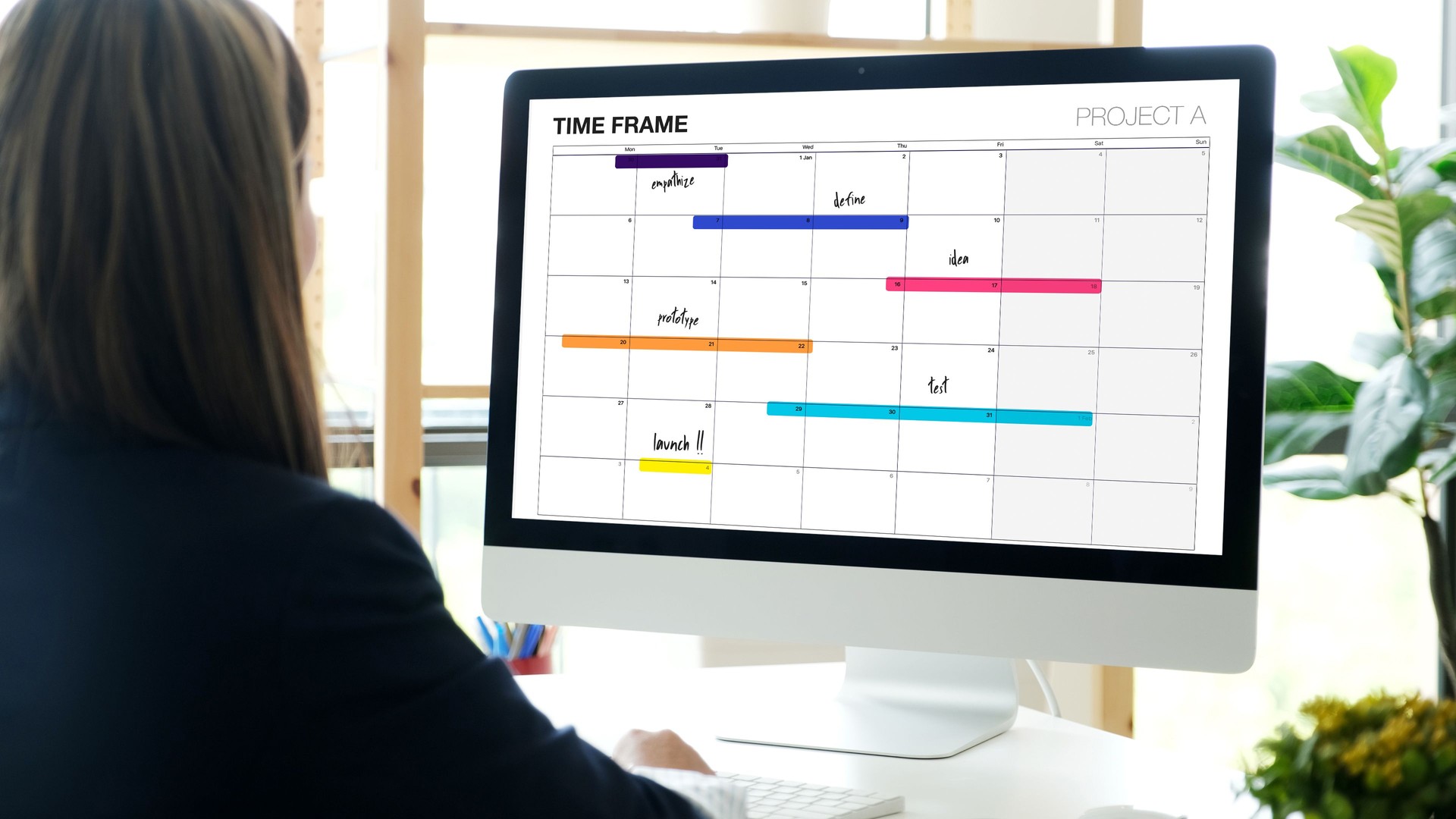 Woman using computer with timeline project schedule, work plan mangement, at home office